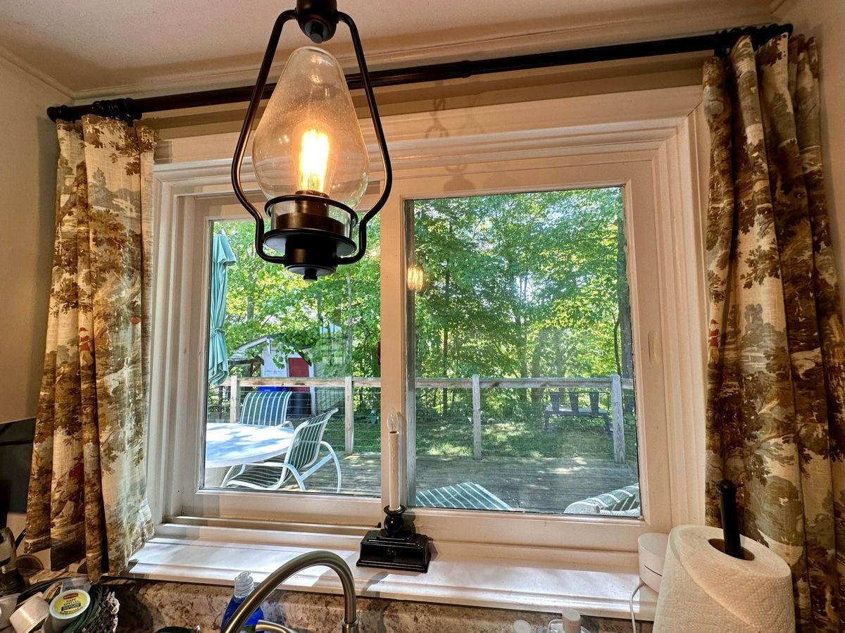 Full kitchen with window overlooking the trees